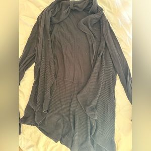 Mullet cut black sweater